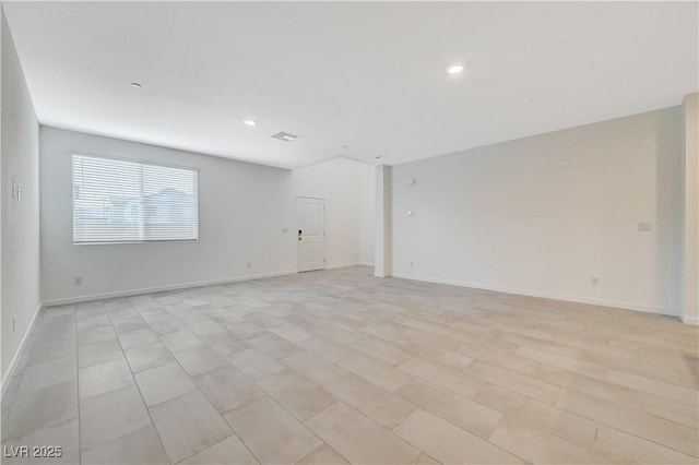 empty room featuring visible vents, baseboards, and recessed lighting