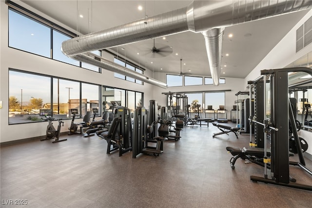 gym featuring recessed lighting, a high ceiling, visible vents, a ceiling fan, and baseboards