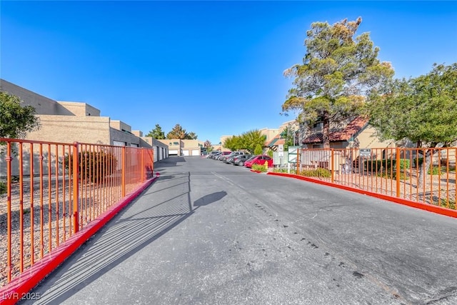 view of street with a residential view and curbs