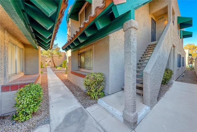 view of side of property featuring stucco siding