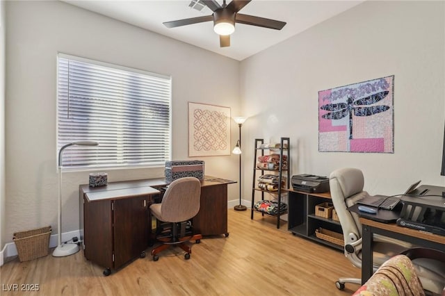 office with light wood-type flooring, ceiling fan, and baseboards