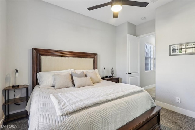 bedroom with ceiling fan, carpet floors, and baseboards