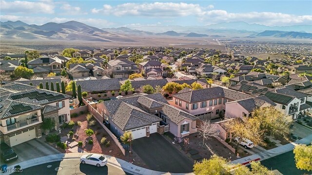 drone / aerial view with a residential view and a mountain view