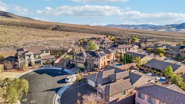 drone / aerial view featuring a residential view and a mountain view