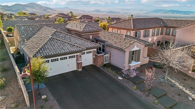 drone / aerial view with a residential view and a mountain view