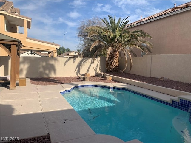 view of swimming pool with a patio, a fenced backyard, and a fenced in pool