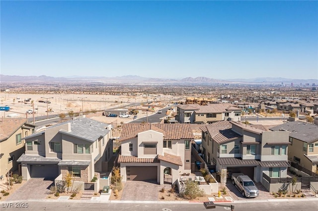 bird's eye view featuring a mountain view and a residential view