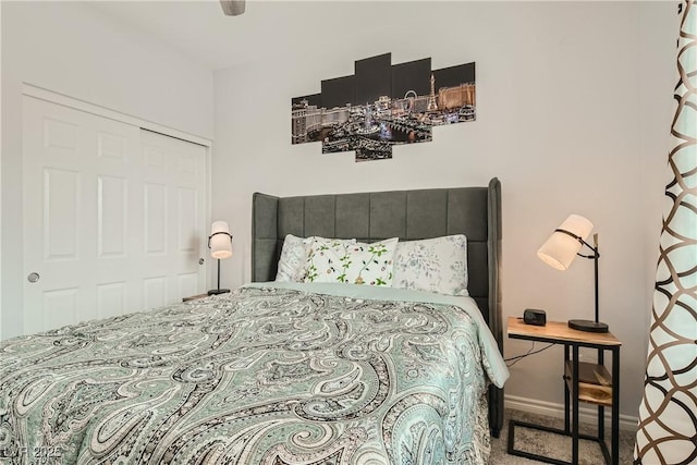 bedroom with carpet and baseboards