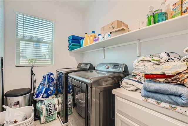 washroom with laundry area and separate washer and dryer