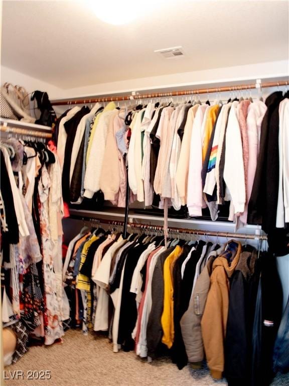 walk in closet with carpet flooring and visible vents