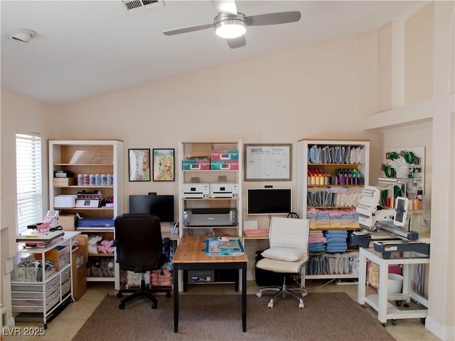 tiled office space featuring ceiling fan, visible vents, and vaulted ceiling