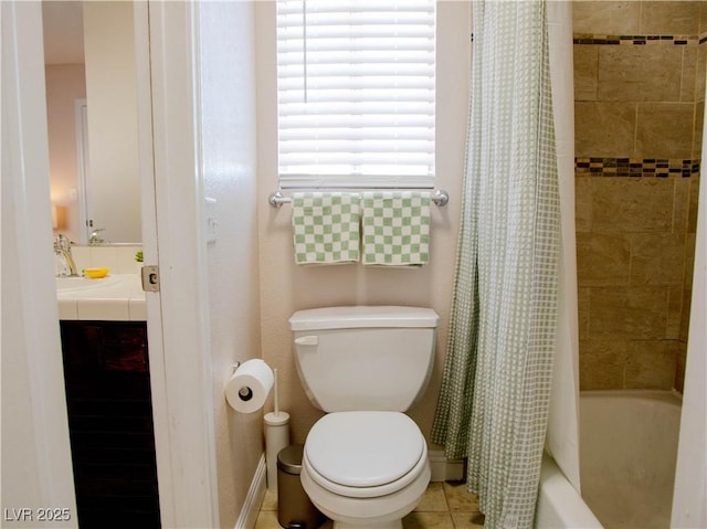 bathroom featuring toilet, tile patterned floors, vanity, baseboards, and shower / tub combo with curtain