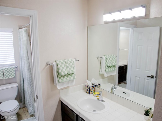 full bathroom with curtained shower, tile patterned flooring, vanity, and toilet