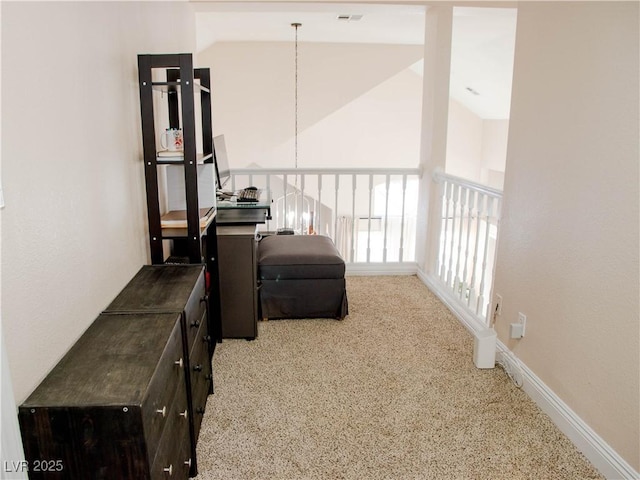 living area featuring high vaulted ceiling, carpet, visible vents, and baseboards