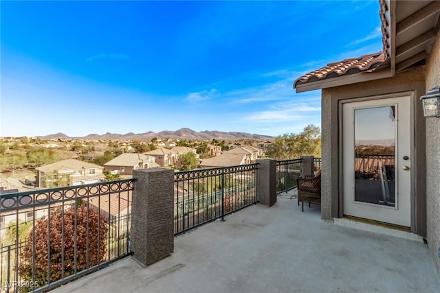 balcony featuring a mountain view