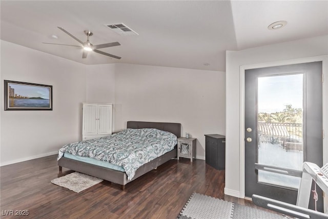 bedroom featuring ceiling fan, baseboards, visible vents, and wood finished floors
