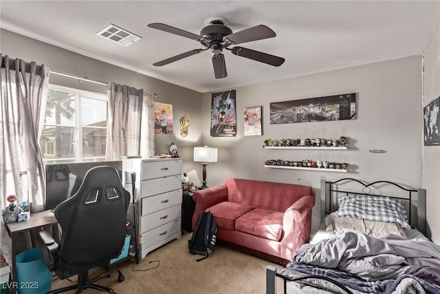 bedroom with light colored carpet, visible vents, and ceiling fan