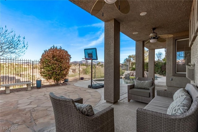 view of patio with an outdoor hangout area, fence, a ceiling fan, and a fenced in pool