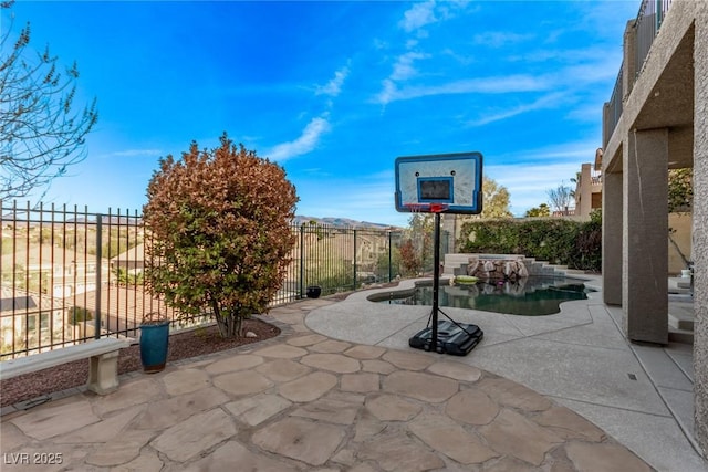 view of patio / terrace with a fenced in pool and a fenced backyard