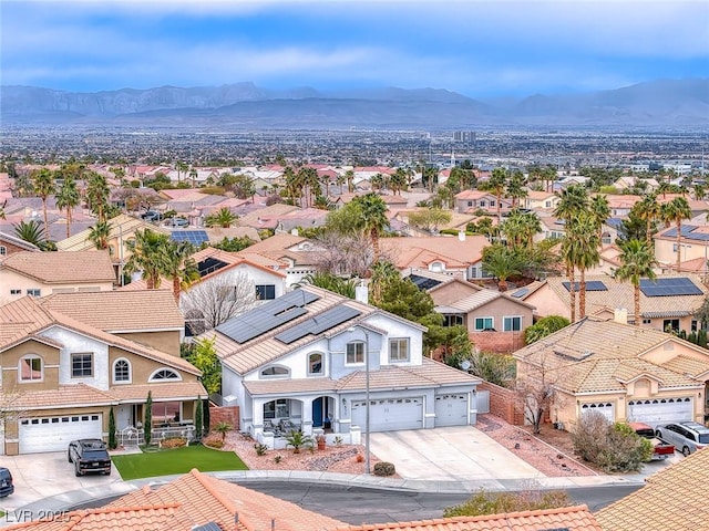 birds eye view of property with a residential view and a mountain view