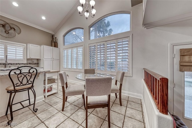 dining area featuring plenty of natural light, ornamental molding, light tile patterned flooring, and an inviting chandelier