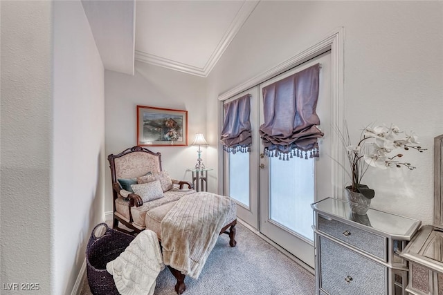 sitting room featuring carpet flooring and crown molding