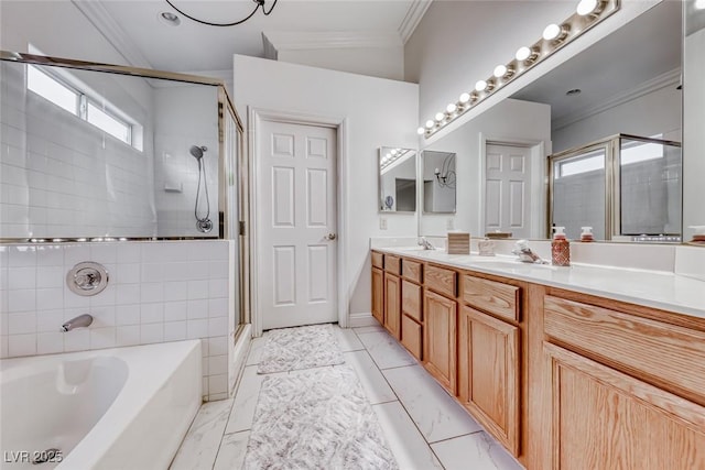 full bathroom featuring marble finish floor, a garden tub, crown molding, a stall shower, and a sink