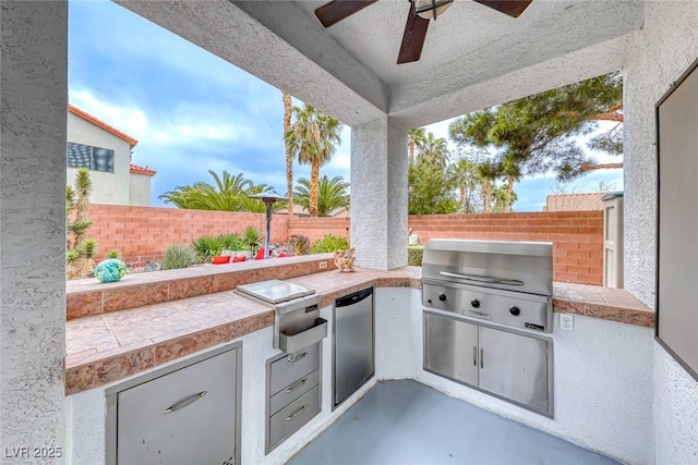 view of patio / terrace featuring area for grilling, ceiling fan, grilling area, and a fenced backyard