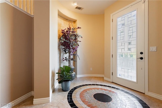 doorway featuring visible vents and baseboards