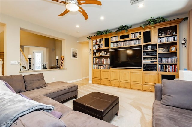 living room featuring light carpet, baseboards, a ceiling fan, and recessed lighting