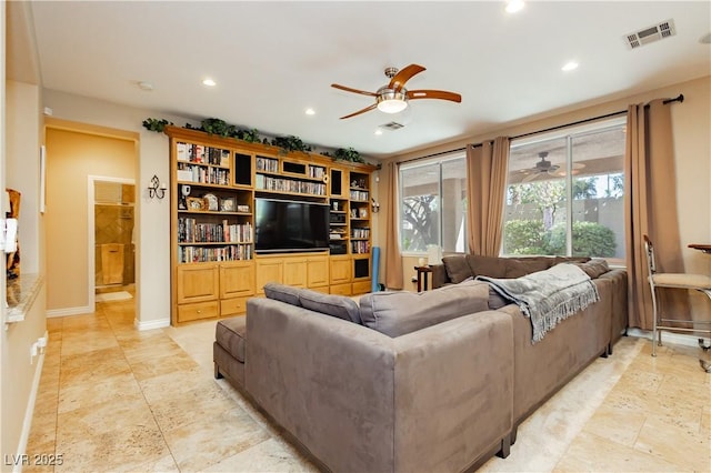 living room with baseboards, visible vents, a ceiling fan, and recessed lighting