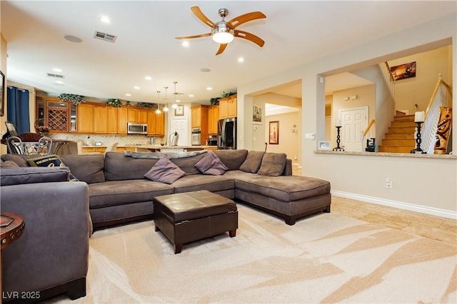 living room featuring recessed lighting, visible vents, stairway, ceiling fan, and baseboards