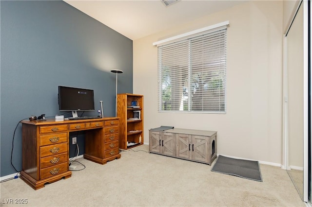 office space with light colored carpet and baseboards