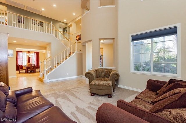 living room with recessed lighting, a towering ceiling, carpet flooring, baseboards, and stairs