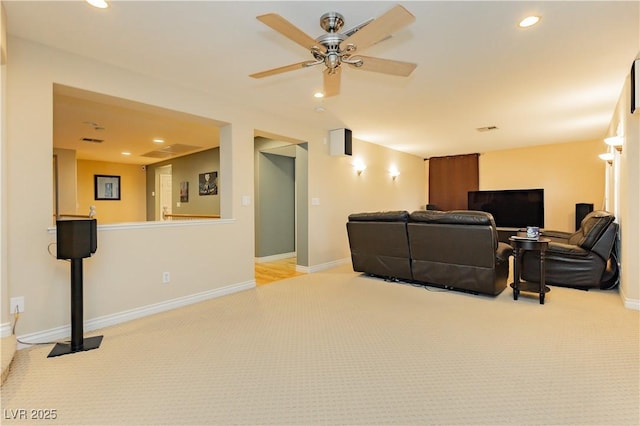 cinema room featuring light carpet, baseboards, a ceiling fan, and recessed lighting