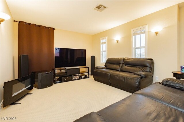 carpeted living room with visible vents