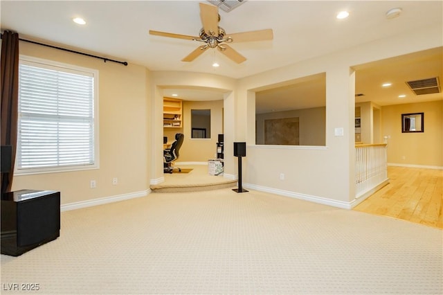 empty room featuring baseboards, visible vents, and recessed lighting