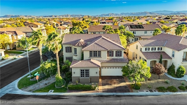 drone / aerial view featuring a mountain view and a residential view