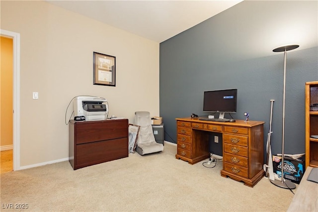 carpeted home office with baseboards