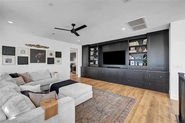 living room with light wood-style floors, recessed lighting, visible vents, and ceiling fan