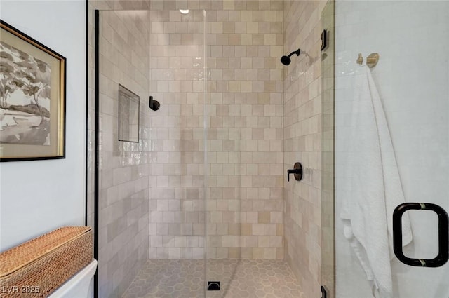 bathroom with a shower stall