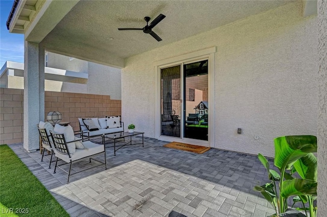 view of patio / terrace with ceiling fan, fence, and outdoor lounge area