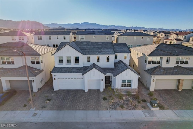 bird's eye view featuring a residential view and a mountain view