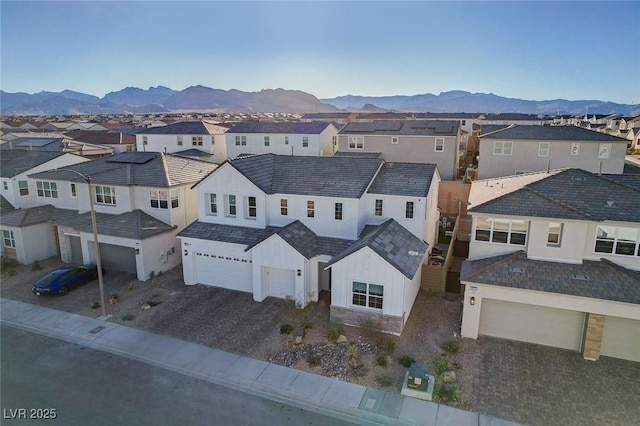 aerial view with a mountain view and a residential view