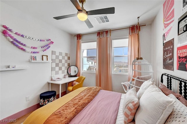 bedroom with a ceiling fan and visible vents