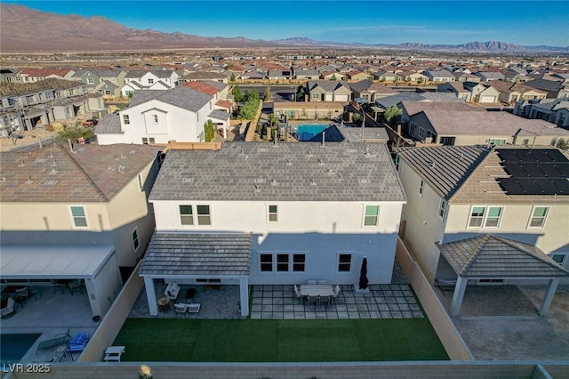 birds eye view of property featuring a mountain view and a residential view