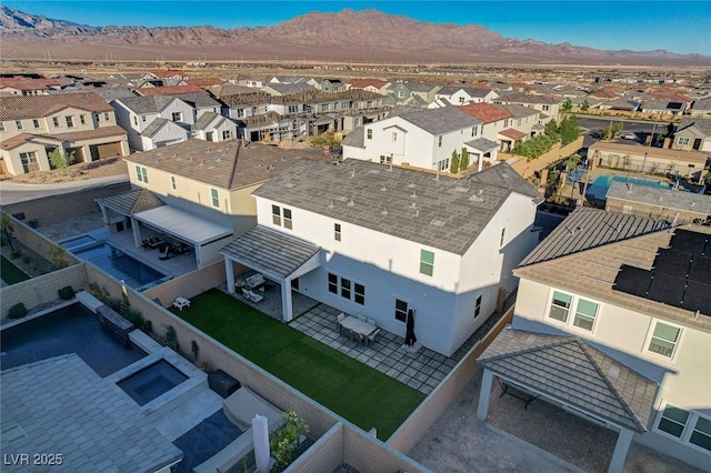 birds eye view of property featuring a mountain view and a residential view