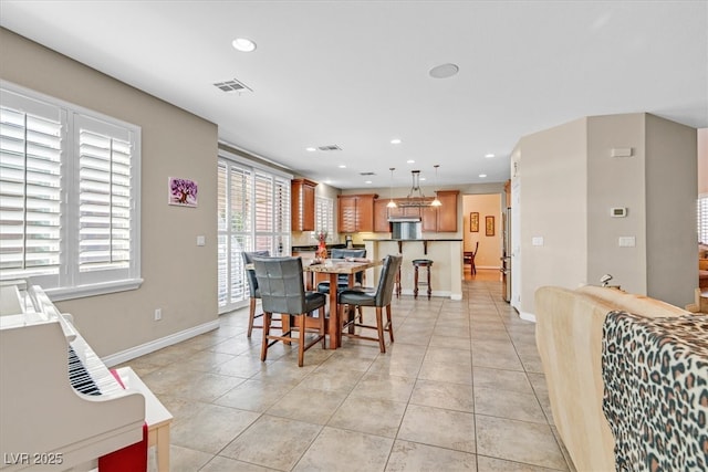 dining area featuring light tile patterned flooring, visible vents, and recessed lighting