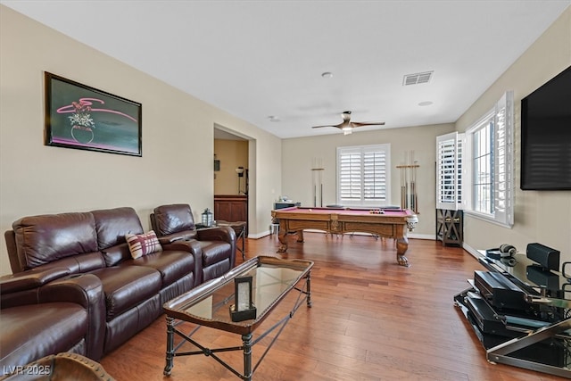 living area with baseboards, billiards, visible vents, and wood finished floors