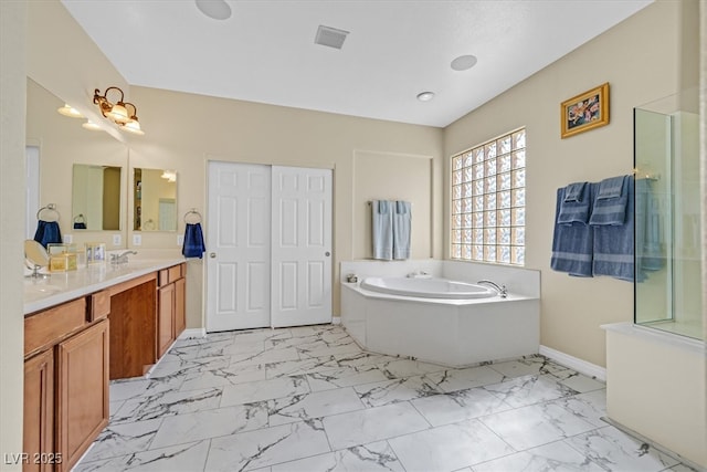 bathroom with vanity, baseboards, marble finish floor, a bath, and an enclosed shower